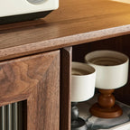 Elegant Wooden Display Cabinet with Drawers and Glass Door